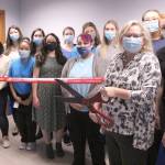 Employees of the Caravel Autism Health clinic pose for a photo with Mayor Jim Ferrell and Chamber CEO Rebecca Martin. Olivia Sullivan/the Mirror