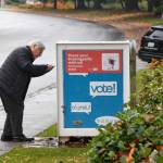A voter drops off their ballot for the King County general election on Nov. 2, 2021. Henry Stewart-Wood/Sound Publishing