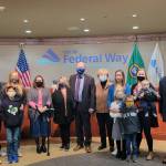 Jack Walsh, center, stands with city electeds and his family members during a private swearing-in ceremony for his council seat on Nov. 23. Photo courtesy of the City of Federal Way