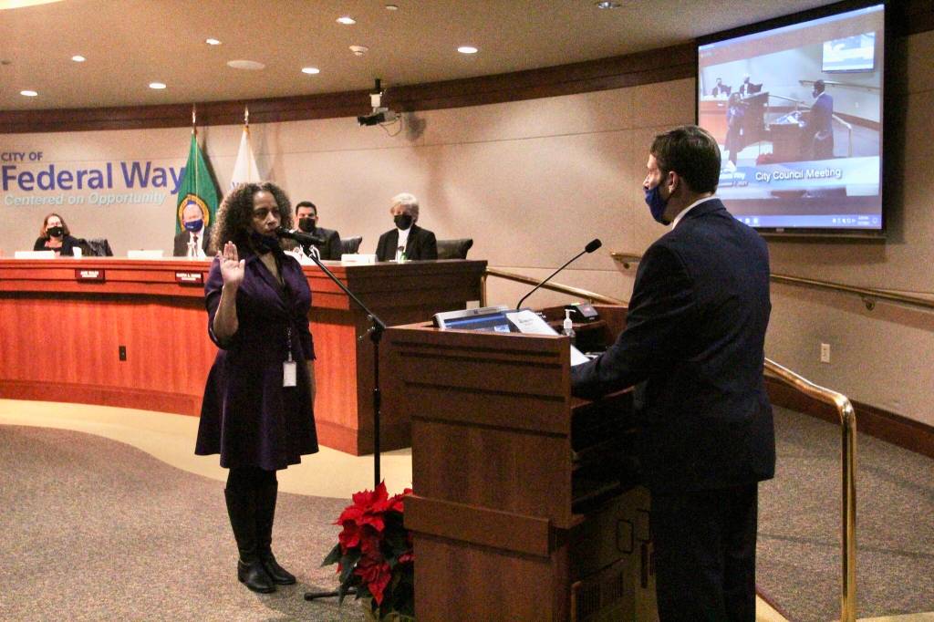 Erica Norton sworn into her council seat by Mayor Jim Ferrell on Dec. 7. Olivia Sullivan/the Mirror