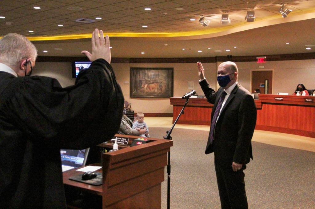 Jack Walsh sworn into his council seat by Judge Dave Larson on Dec. 7. Olivia Sullivan/the Mirror