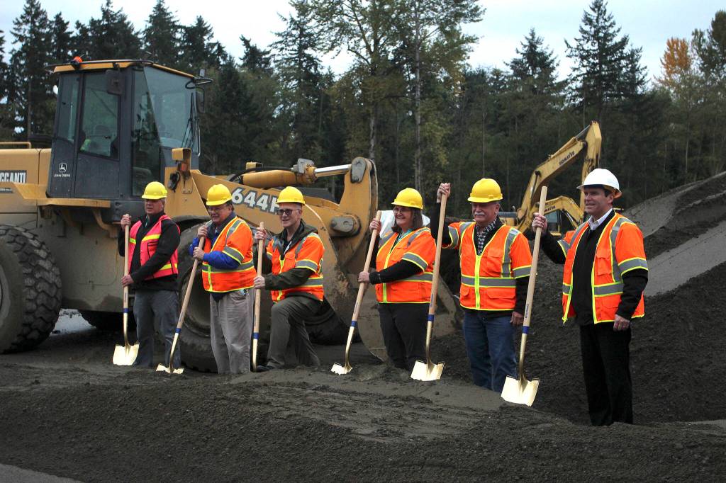 Lakehaven Water & Sewer District commissioners break ground on the new headquarters building with Lakehaven General Manager John Bowman (far right). Olivia Sullivan/the Mirror