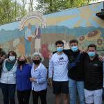 Kae Lee, fourth from left, stands for a photo with volunteers at the food bank on April 29, 2021. Olivia Sullivan/the Mirror