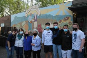 Kae Lee, fourth from left, stands for a photo with volunteers at the food bank on April 29, 2021. Olivia Sullivan/the Mirror