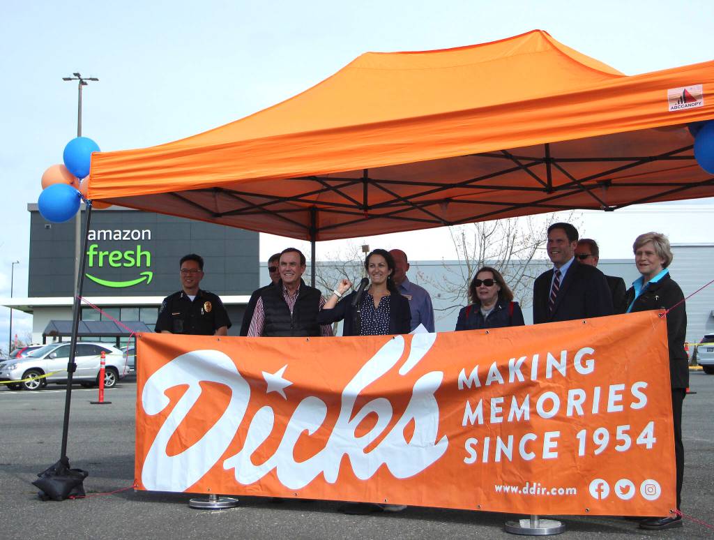Dicks Drive-In President Jasmine Donovan, center, speaks to the crowd during the location reveal celebration on April 28. She is joined by several local officials and business leaders. Olivia Sullivan/the Mirror