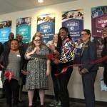 Some of the first students to take classes at The Hub help cut the ribbon on May 13. Olivia Sullivan/the Mirror