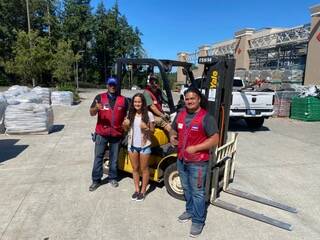 Hanna Banks with Lowes employees. Photo courtesy of Hanna Banks