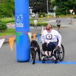 Brittany App crosses the finish line on July 4. Photo by Bruce Honda