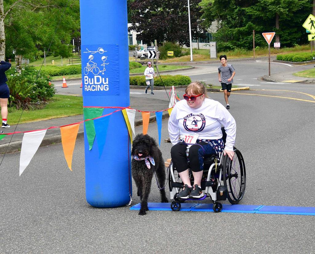 Brittany App crosses the finish line on July 4. Photo by Bruce Honda