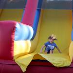 Violet slides down the inflatable obstacle course on July 4. Olivia Sullivan/the Mirror