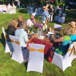 Attendees gathered around tables for food and conversation during the 2021 FUSION arts festival at Dumas Bay Centre.
