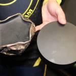 The difference between a blind hockey puck used after one game and a brand new one. Photo by Bailey Jo Josie/Sound Publishing