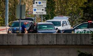 Law enforcement officials investigate the scene of a fatal shooting near a freeway ramp in Federal Way on May 4. Photo courtesy of South Sound News