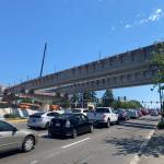Cars drive under the newly installed elevated tracks in Federal Way on July 28. Olivia Sullivan/the Mirror