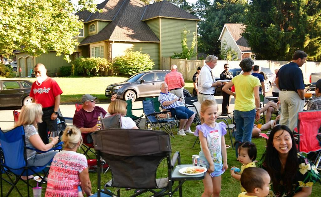 Neighbors gather to celebrate National Night Out on Aug. 2. Photo by Bruce Honda
