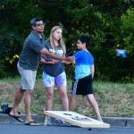 A local resident makes a toss playing cornhole on Aug. 2. Photo by Bruce Honda
