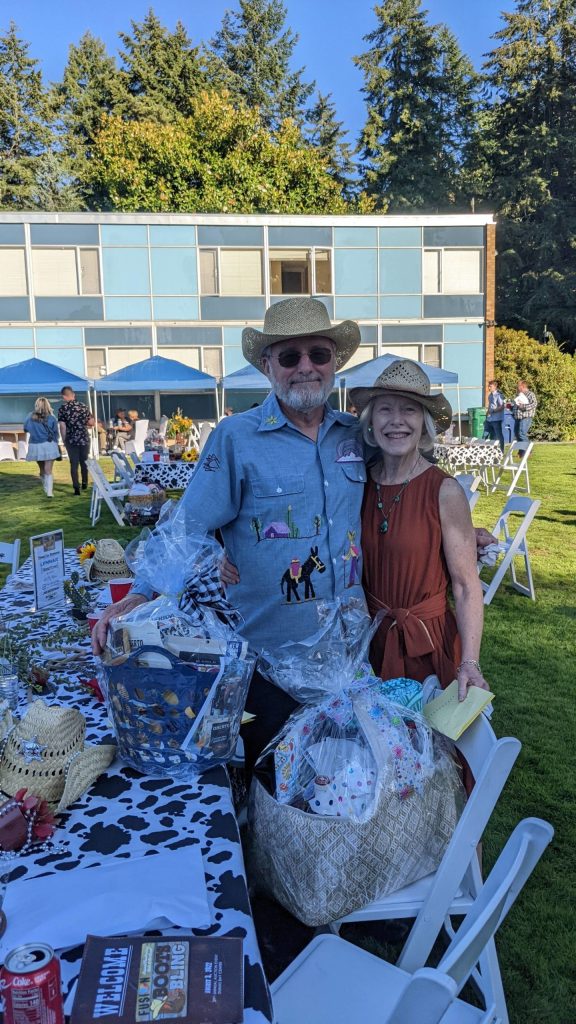 Couple wins two baskets and a massage gift certificate at silent auction. Photo by Sarah Fox.