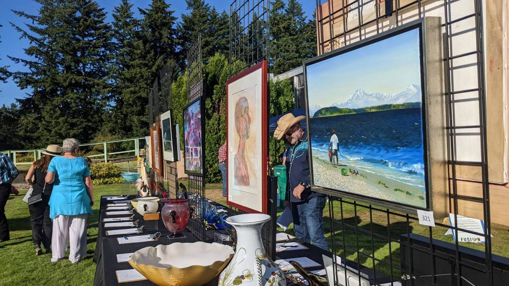 Silent auction art bid items at FUSION Art Event August 3. Photo by Sarah Fox.