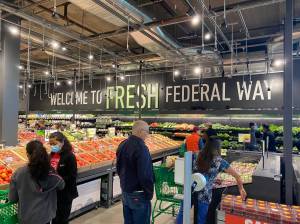 A sign in the produce section says Welcome to Fresh Federal Way. Olivia Sullivan/the Mirror
