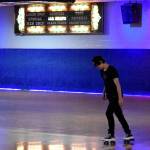 T.K., an employee at Pattisons West, practices some moves before the rink opens Tuesday afternoon. Alex Bruell/Sound Publishing