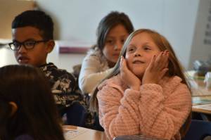 Photos by Alex Bruell/Federal Way Mirror
Left, a student at Star Lake Elementary daydreams out loud about some of her favorite foods on the first day of school. Right, Students at Star Lake Elementary listen as their teacher greets them on the first day of school.