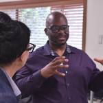 Federal Way Public Schools Superintendent Dr. Dani Pfeiffer listens as Louis Guiden speaks to a crowd at Good Shepherd.