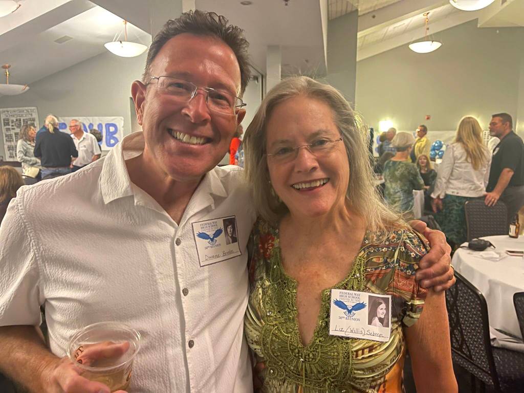 Dwaine Bowden, class of 1972 and Liz Willis Sebren, class of 1971 pose for a picture.