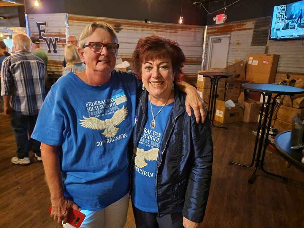 Class of 1972 graduates Anne Halvorsen and Deby Englund pose for a picture.