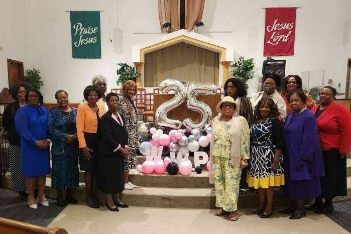 Supporters of Women who Pray from around the region, including Olympia, Renton, Tacoma and Seattle, assemble for a photo at the groups 25th anniversary event last month. Some out-of-state or international supporters and delegations werent able to attend. Photo courtesy Carolyn Hood.