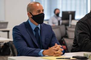 One of two Federal Way police officers who fatally shot Robert Lightfeather in 2017, Austin Rogers, listens during the inquest into the shooting at the Patricia H. Clark Children and Family Justice Center on Monday, Sept. 26, 2022. (Kylie Cooper / The Seattle Times)