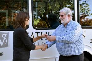 Andrea Peterson officially hands the keys to a new van to Mac Hoover of Christs Church in Federal Way. Alex Bruell/Sound Publishing