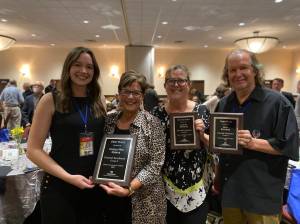 From left, Assistant Editor Olivia Sullivan, Federal Way Mirror Sales Manager Cindy Ducich, Advertising Director Carol Greiling and the Kent Reporters Steve Hunter hold their General Excellence awards at the WNPA conference on Oct. 8. Terry Ward/Sound Publishing