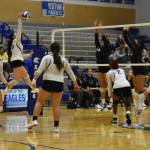 Federal Ways Madison Mulipola on the attack in the third set of their match with Kentwood. Photo by Ben Ray/Sound Publishing