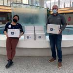 WGU staff works with Shelly Caldejon from the UW Valley Medical Center to deliver packages to 200 employees. COURTESY PHOTO, WGU