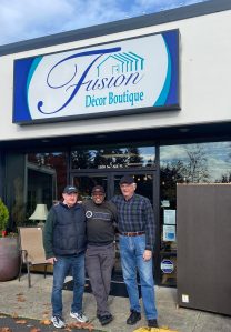 Olivia Sullivan/the Mirror
Marvin C. Moye, center, stands outside the FUSION Décor Boutique on Nov. 8 with Mike Kelly, left, and Dave Sharp.