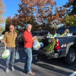 Volunteers load donated turkeys ahead of the Thanksgiving giveaway. Photo courtesy of Shelley Pauls