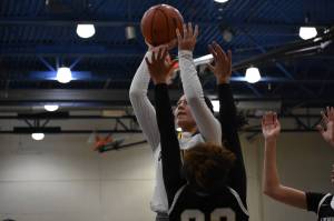 Decatur senior Lani McConville takes a mid range jump shot. Ben Ray/Sound Publishing