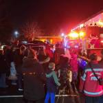 Community members gather to see Santa and Mrs. Claus during a December Santa Parade. Photo courtesy of South King Fire and Rescue