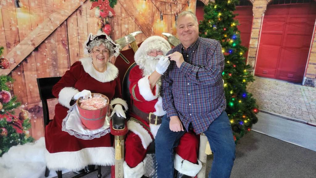 SKFR Assistant Chief Kevin Crossen pleads his case to Santa Claus and Mrs. Claus to end up on the nice list this year at the first-ever SKFR Santa event held on Sunday, Dec. 18. Photo courtesy of South King Fire and Rescue
