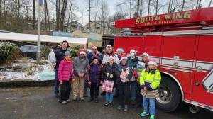 SKFR members bring donations for the Federal Way Senior Center Food Bank on Dec. 19. Photo courtesy of South King Fire and Rescue