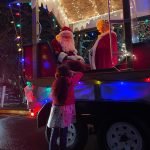 A child talks to Santa and Mrs. Claus along one of the South King Fire and Rescue Santa Parade routes this month. Photo courtesy of South King Fire and Rescue