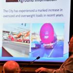 Public Works Development Services Manager Cole Elliott gives a presentation on the increase of oversize- and overweight-loaded vehicles in Federal Way in recent years, many of those vehicles travelling on non-designated truck routes which increases wear-and-tear of city infrastructure. An ordinance in the works would seek to work cooperatively with haulers to minimize that damage. Photo by Bruce Honda