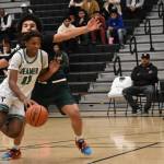MVP of the tournament William Tellis drives to the basket. Ben Ray/Sound Publishing
