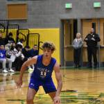 Federal Way senior Isaiah Afework looks for the open lane against the Trojans. Photo by Ben Ray/Sound Publishing