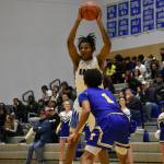 Senior Vaughn Weems raises the ball above his head, as he looks for his teammates. Ben Ray/The Mirror