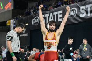 CJ Trevino looks to the crowd after he places third in his weight class. Ben Ray / The Mirror