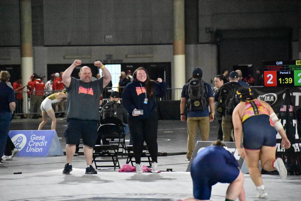 Decatur coaches celebrate Sissy placing third after her win. Ben Ray / The Mirror