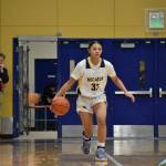 Freshman Leilah Mulivai-Tobin takes the ball up the floor for the Gators. (Photos by Ben Ray / The Mirror)