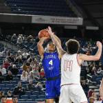 Federal Way junior Kofie Peyton takes a contested jump shot against Mount Si. Ben Ray / The Mirror