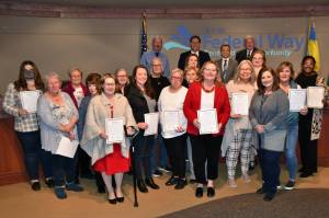 Photo by Bruce Honda
Numerous notable women in the Federal Way community stand for a picture as the city council honors Womens History Month.